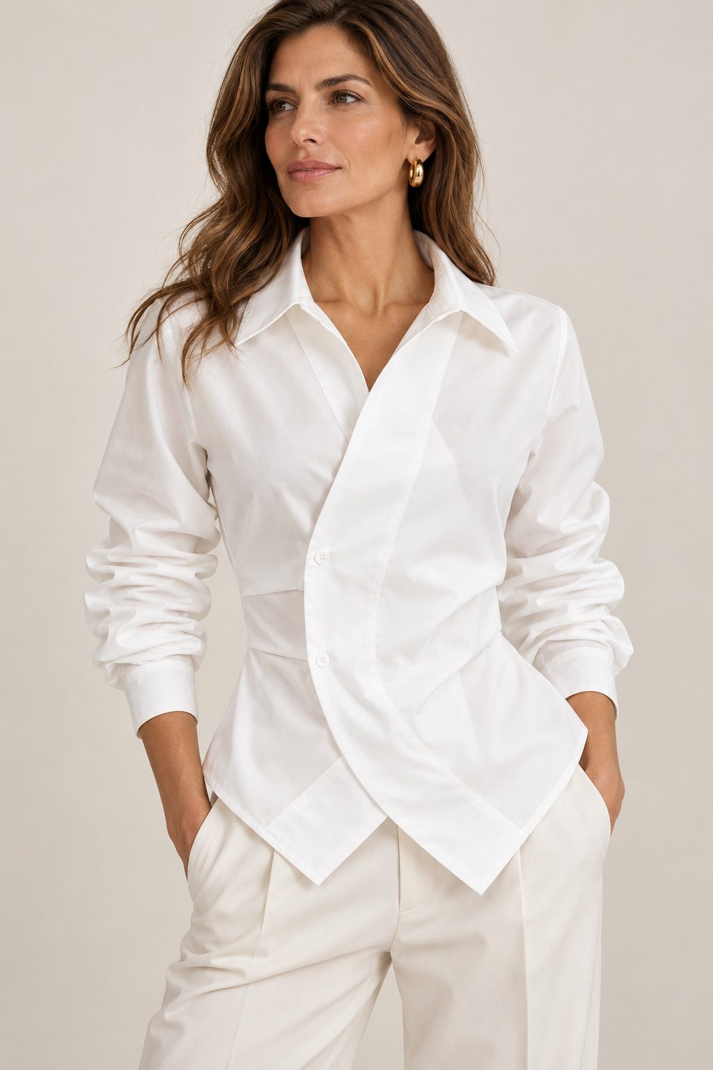 Model wearing the Lisbon white wrap shirt with ivory wide-leg trousers
