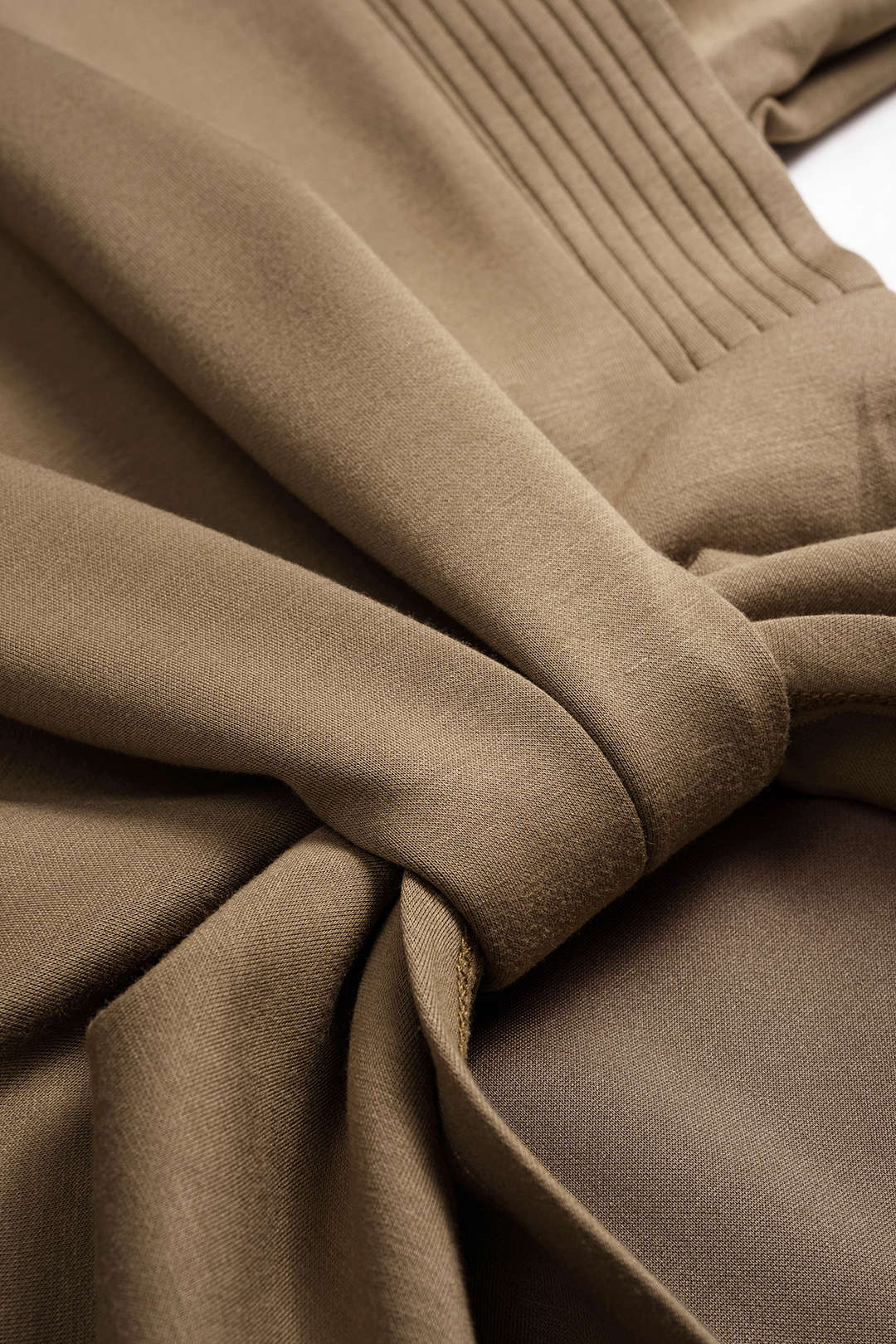 Close-up of the twisted knot and pleated shoulder detail on the Kyoto Gathered Top