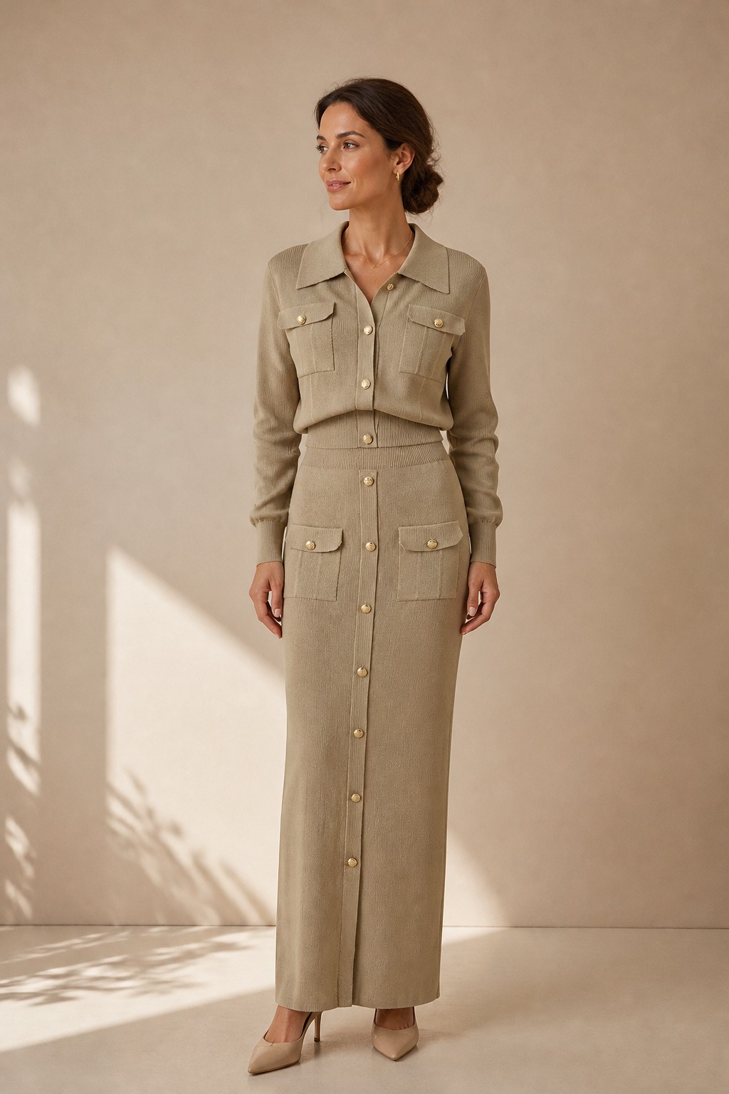 Model wearing the Vienna Knit Two-Piece Set in khaki, front view, cropped button-up cardigan and maxi skirt, Revelle Toronto